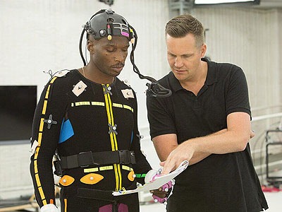 Michael Young works with former NFL receiver Chad (“Ochocinco”) Johnson before a shot.