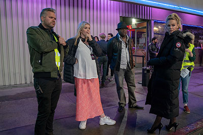 [L-R] Director of photography Benjamin Kracun, writer-director Emerald Fennell, Sam Richardson, and Carey Mulligan on the set of <i>Promising Young Woman</i>.